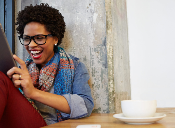woman looking at tablet